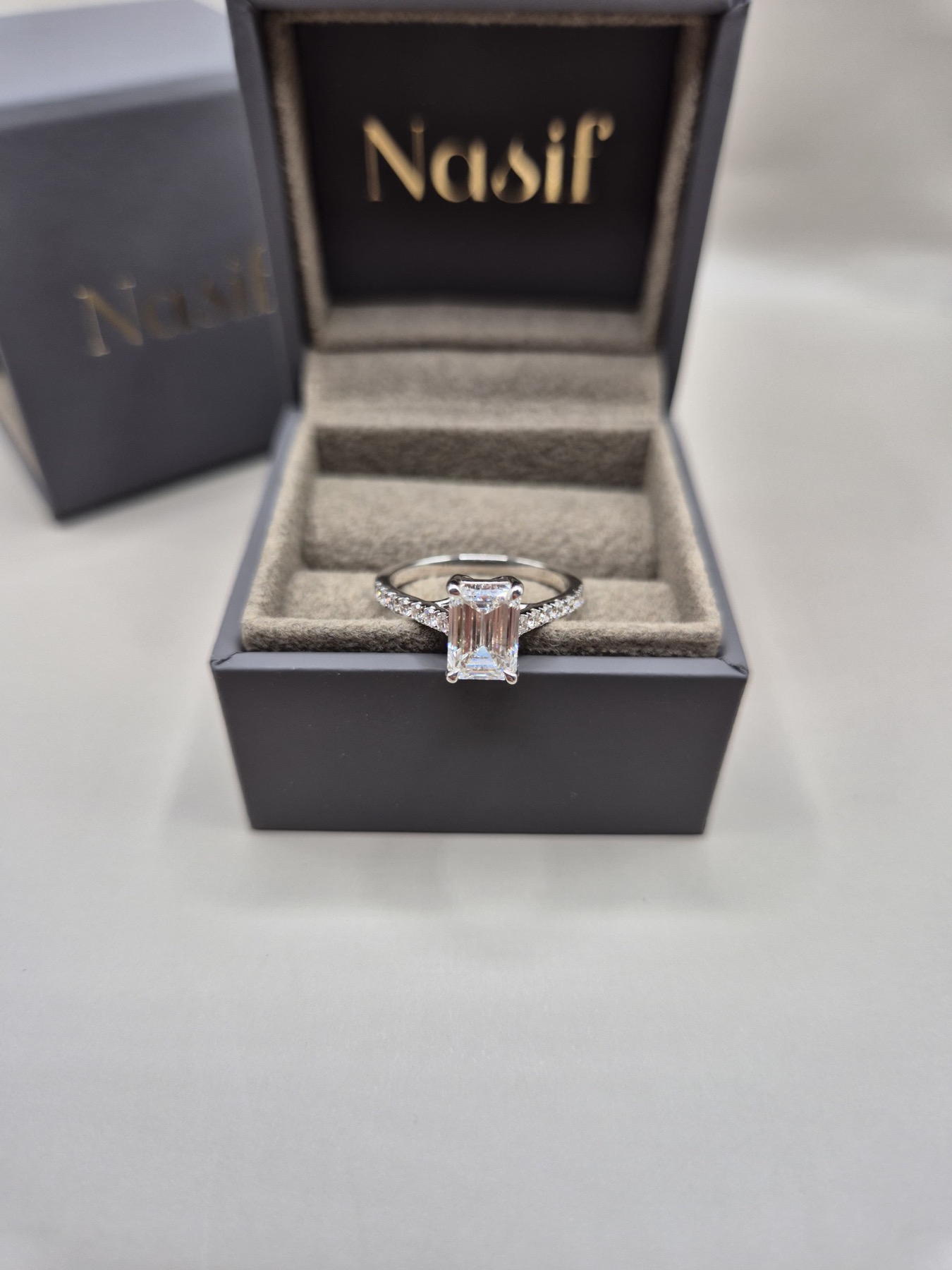 Emerald-cut diamond solitaire in a Nasif jewellery box